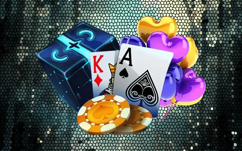 Playing cards and casino chips on a green background.